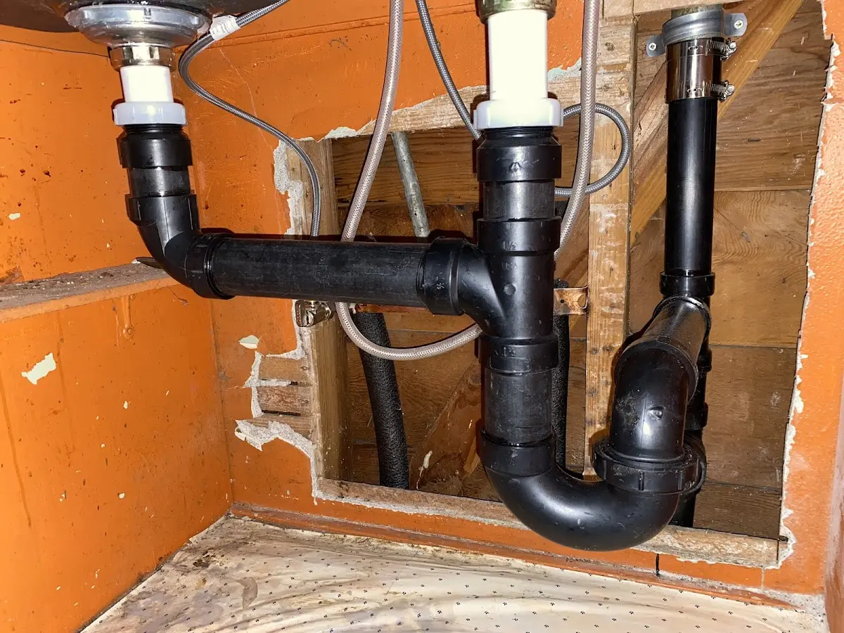 Professional Garbage Disposal Repair equipment and tools on the job in Trumbull